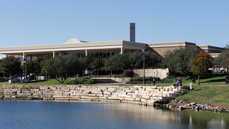 campus landscape with a pond in front